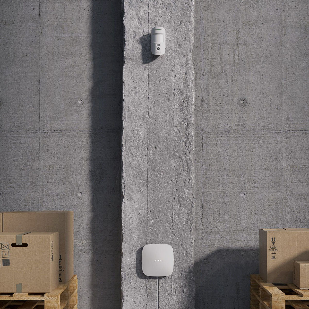 Lifestyle Image of device installed on a concrete wall in a warehouse setting.