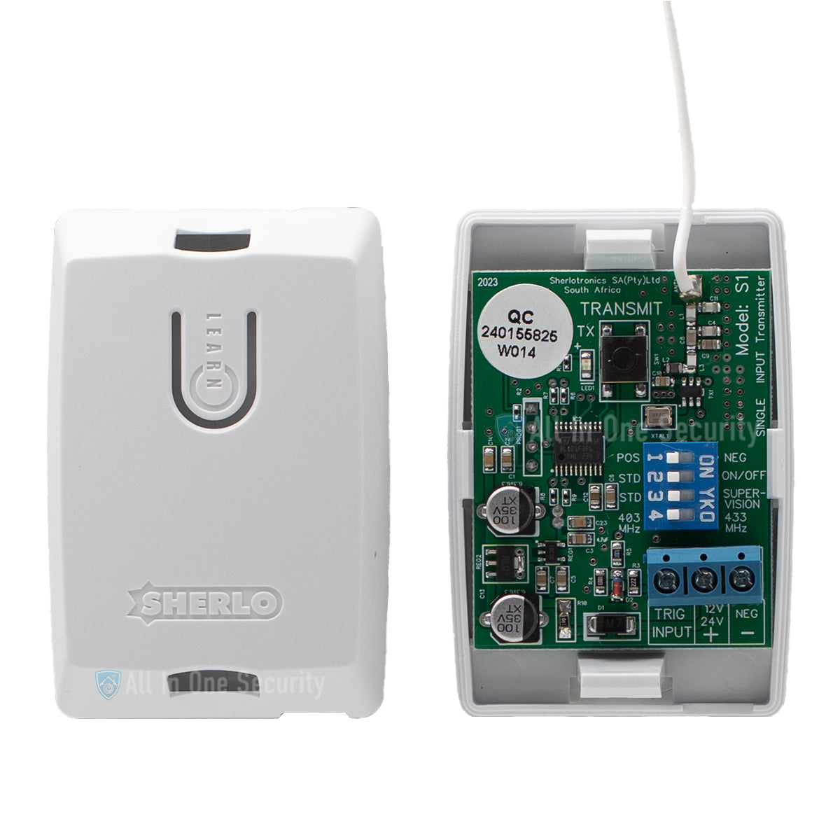 Sherlotronics 1 channel indoor transmitter S1 inside view with circuit board, input terminals, and learn button casing