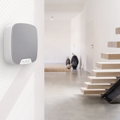 Ajax compact wireless indoor home siren in white.