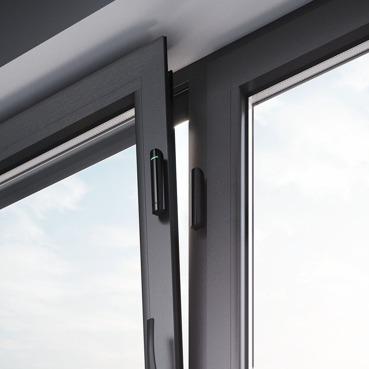 Ajax wireless black DoorProtect opening detector installed on window frame for advanced home and office security monitoring.