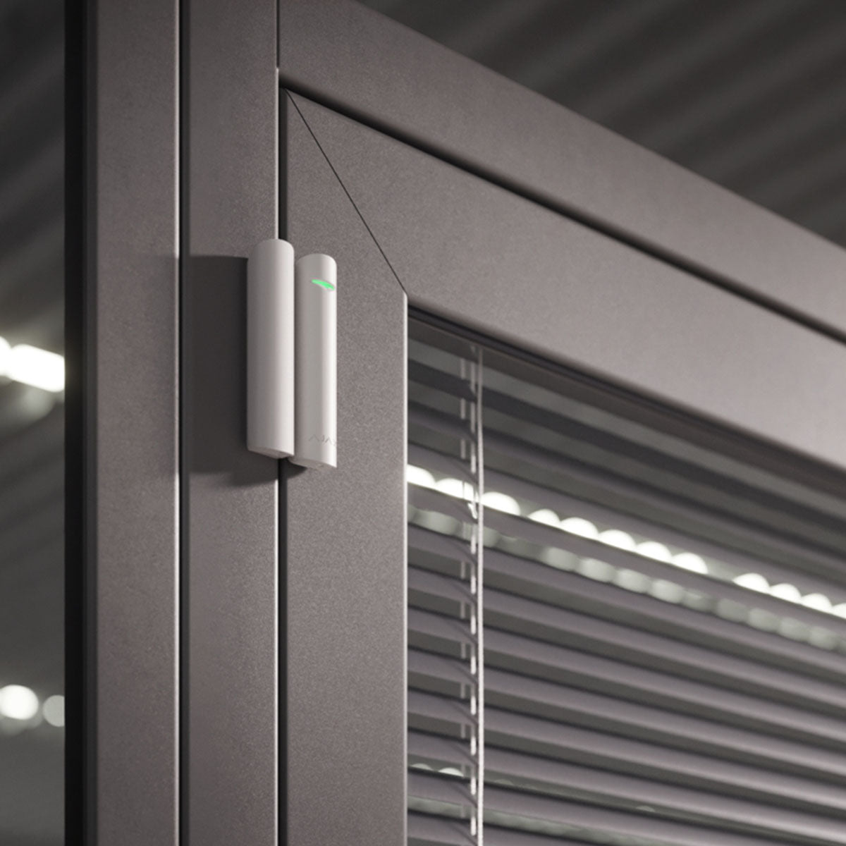 Ajax wireless DoorProtect opening detector in white, mounted on a door frame for reliable smart home security.