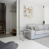 Room with Ajax CombiProtect wireless indoor motion sensor installed on wall