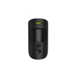 Front view of a black Ajax wireless indoor motion camera with sensors and a green indicator light.