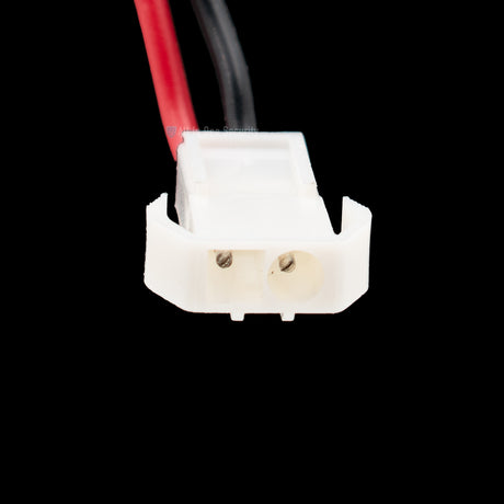 Close-up image of a white plastic Molex connector clip, with two pin slots and a locking mechanism on the side.