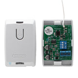 Sherlotronics 1 channel indoor transmitter S1 inside view with circuit board, input terminals, and learn button casing