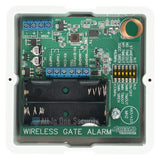 Sherlotronics wireless gate alarm transmitter 433Mhz PCB view showing circuit board, terminals, and battery compartment